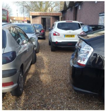 image of cars parked closely together in the church car park
